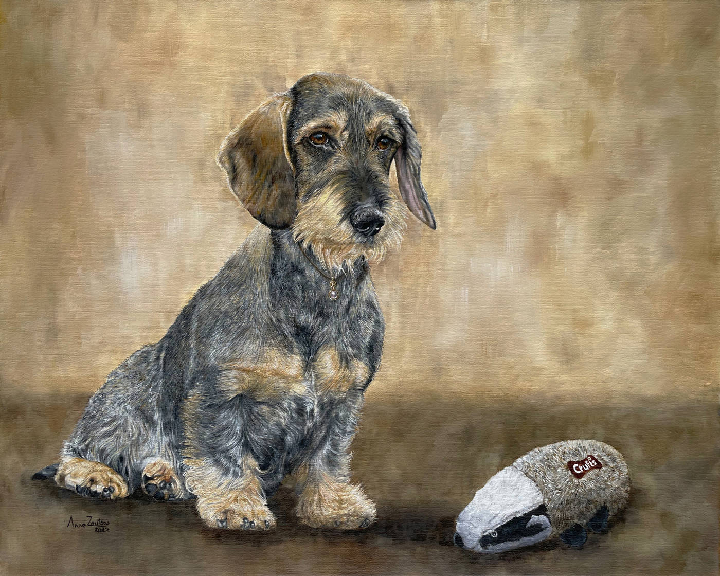 A wire-haired dachshund sitting with a toy badger, wearing a pearl collar